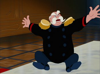 Movie still from “Cinderella” (1950), directed by Hamilton Luske – An animated character in military garb is kneeling down; Medium shot, High angle