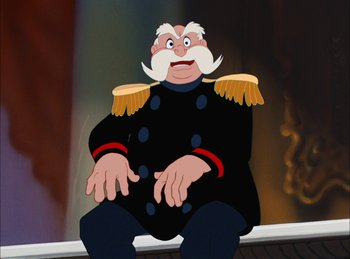 Movie still from “Cinderella” (1950), directed by Hamilton Luske – An old man in a military uniform sitting on a bench; Medium shot, Low angle