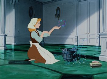 Movie still from “Cinderella” (1950), directed by Hamilton Luske – A woman is playing with a ball in a room; Wide shot, High angle