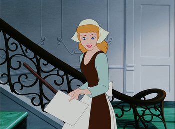 Movie still from “Cinderella” (1950), directed by Hamilton Luske – A woman holding a piece of paper while standing on stairs; Medium shot, High angle