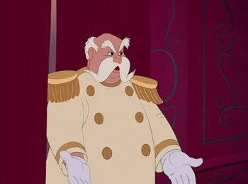 Movie still from “Cinderella” (1950), directed by Hamilton Luske – A man in a white coat and white gloves; Medium shot, Over the shoulder angle