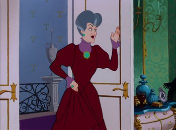 Movie still from “Cinderella” (1950), directed by Hamilton Luske – An old woman in a red dress is standing in front of a door; Medium shot, Over the shoulder angle