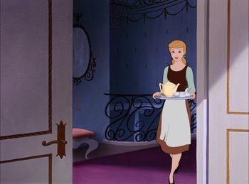 Movie still from “Cinderella” (1950), directed by Hamilton Luske – A woman holding a tray of food in a room; Wide shot, High angle