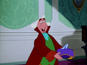 Movie still from “Cinderella” (1950), directed by Hamilton Luske – A cartoon character holding something; Medium shot, Over the shoulder angle