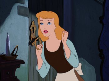 Movie still from “Cinderella” (1950), directed by Hamilton Luske – A cartoon of a woman holding a pretzel in front of her face; Close Up shot, Over the shoulder angle