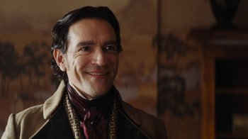 Movie still from “Cinderella” (2015), directed by Kenneth Branagh – A person wearing a suit and tie; Close Up shot, Over the shoulder angle