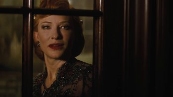 Movie still from “Cinderella” (2015), directed by Kenneth Branagh – A woman with red hair looking out of a window; Close Up shot, Over the shoulder angle
