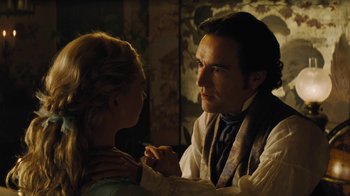 Movie still from “Cinderella” (2015), directed by Kenneth Branagh – A man and a woman holding hands in a dimly - lit room; Close Up shot, Over the shoulder angle