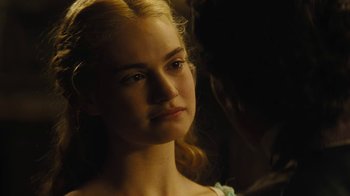 Movie still from “Cinderella” (2015), directed by Kenneth Branagh – A woman with blonde hair and a blue dress; Close Up shot, Over the shoulder angle