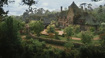 Movie still from “Cinderella” (2015), directed by Kenneth Branagh – An animated picture of a castle with a lot of trees around it; Extreme Wide shot, High angle