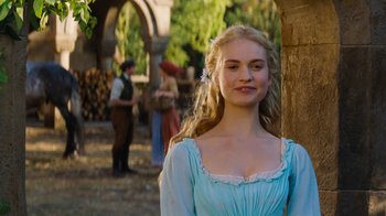 Movie still from “Cinderella” (2015), directed by Kenneth Branagh – A woman in a blue dress standing in front of people; Medium shot, Over the shoulder angle