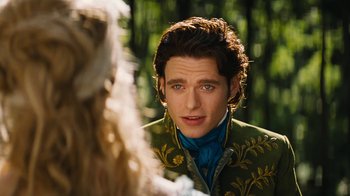 Movie still from “Cinderella” (2015), directed by Kenneth Branagh – A man in a green and blue jacket looking at a woman; Close Up shot, Over the shoulder angle
