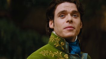 Movie still from “Cinderella” (2015), directed by Kenneth Branagh – A man wearing a green jacket; Close Up shot, Low angle