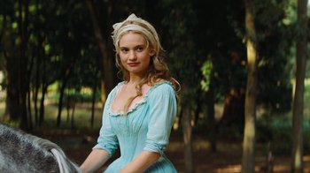 Movie still from “Cinderella” (2015), directed by Kenneth Branagh – A beautiful young lady wearing a blue dress; Close Up shot, Over the shoulder angle
