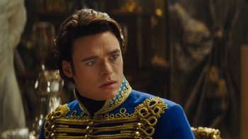 Movie still from “Cinderella” (2015), directed by Kenneth Branagh – A person wearing a uniform; Close Up shot, Over the shoulder angle