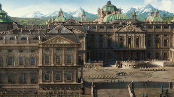 Movie still from “Cinderella” (2015), directed by Kenneth Branagh – An image of an old building with a mountain in the background; Extreme Wide shot, High angle