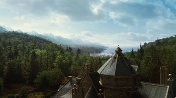 Movie still from “Cinderella” (2015), directed by Kenneth Branagh – An aerial view of a large building with a lake in the background; Extreme Wide shot, High angle