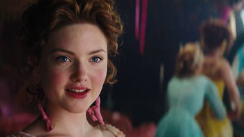 Movie still from “Cinderella” (2015), directed by Kenneth Branagh – A person wearing a dress; Close Up shot, Over the shoulder angle