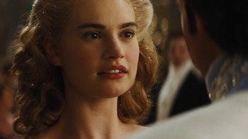 Movie still from “Cinderella” (2015), directed by Kenneth Branagh – A woman's face in front of a man; Close Up shot, Over the shoulder angle