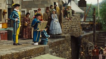 Movie still from “Cinderella” (2015), directed by Kenneth Branagh – A group of people standing on top of a stone wall; Wide shot, High angle