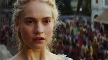 Movie still from “Cinderella” (2015), directed by Kenneth Branagh – A person with a crowd in the background; Close Up shot, Over the shoulder angle