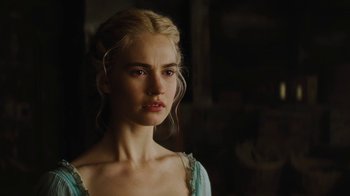 Movie still from “Cinderella” (2015), directed by Kenneth Branagh – A beautiful young woman with blonde hair wearing a blue dress; Close Up shot, Over the shoulder angle