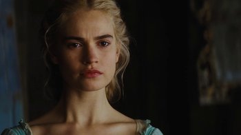 Movie still from “Cinderella” (2015), directed by Kenneth Branagh – A beautiful young woman with blonde hair wearing a blue dress; Close Up shot, Low angle