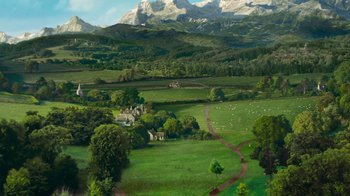 Movie still from “Cinderella” (2015), directed by Kenneth Branagh – An aerial view of a lush green field with sheep grazing; Extreme Wide shot, High angle