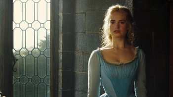 Movie still from “Cinderella” (2015), directed by Kenneth Branagh – A beautiful young lady wearing a blue dress; Close Up shot, Low angle