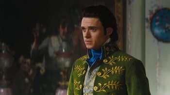 Movie still from “Cinderella” (2015), directed by Kenneth Branagh – A man in a green and blue jacket; Medium shot, Low angle