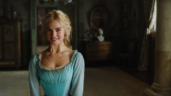 Movie still from “Cinderella” (2015), directed by Kenneth Branagh – A beautiful young lady wearing a blue dress; Medium shot, Over the shoulder angle