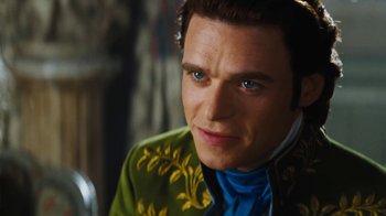 Movie still from “Cinderella” (2015), directed by Kenneth Branagh – A person wearing a jacket; Close Up shot, Over the shoulder angle