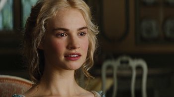 Movie still from “Cinderella” (2015), directed by Kenneth Branagh – A beautiful young woman with long blonde hair; Close Up shot, Over the shoulder angle