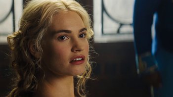 Movie still from “Cinderella” (2015), directed by Kenneth Branagh – A person with blonde curly hair; Close Up shot, Over the shoulder angle