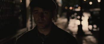 Movie still from “Cinderella Man” (2005), directed by Ron Howard – A person wearing a hat; Close Up shot, Over the shoulder angle