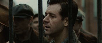 Movie still from “Cinderella Man” (2005), directed by Ron Howard – A person behind a fence; Close Up shot, Low angle