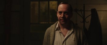 Movie still from “Cinderella Man” (2005), directed by Ron Howard – A man in a brown jacket and a white shirt; Close Up shot, Over the shoulder angle