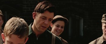 Movie still from “Cinderella Man” (2005), directed by Ron Howard – A man and a woman standing next to each other; Close Up shot, Over the shoulder angle