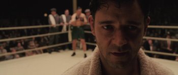 Movie still from “Cinderella Man” (2005), directed by Ron Howard – A person in a boxing ring; Close Up shot, Over the shoulder angle