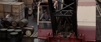 Movie still from “Cinderella Man” (2005), directed by Ron Howard – A man sitting in the driver's seat of a crane; Wide shot, High angle