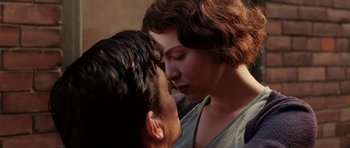 Movie still from “Cinderella Man” (2005), directed by Ron Howard – A man and a woman face to face in front of a building; Close Up shot, Low angle