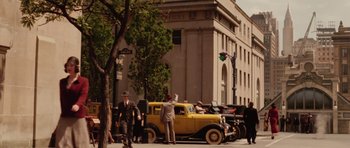 Movie still from “Cinderella Man” (2005), directed by Ron Howard – An old car parked on the side of the street; Extreme Wide shot, Low angle