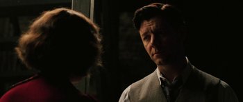 Movie still from “Cinderella Man” (2005), directed by Ron Howard – A man and a woman standing next to each other in front of a window; Close Up shot, Over the shoulder angle