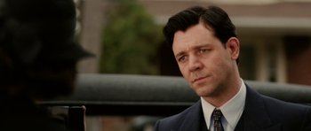 Movie still from “Cinderella Man” (2005), directed by Ron Howard – A person wearing a suit and tie; Close Up shot, Over the shoulder angle