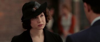 Movie still from “Cinderella Man” (2005), directed by Ron Howard – A person wearing a hat; Close Up shot, Over the shoulder angle
