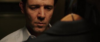 Movie still from “Cinderella Man” (2005), directed by Ron Howard – A person wearing a suit and tie; Close Up shot, Over the shoulder angle
