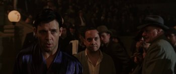 Movie still from “Cinderella Man” (2005), directed by Ron Howard – A group of men standing next to each other in front of a crowd; Close Up shot, Over the shoulder angle