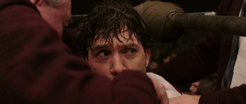 Movie still from “Cinderella Man” (2005), directed by Ron Howard – A person with wet hair; Close Up shot, High angle