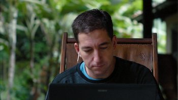 Movie still from “Citizenfour” (2014), directed by Laura Poitras – A man sitting in front of a computer; Close Up shot, High angle