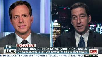 Movie still from “Citizenfour” (2014), directed by Laura Poitras – Two men are talking on a news show; Close Up shot, Low angle